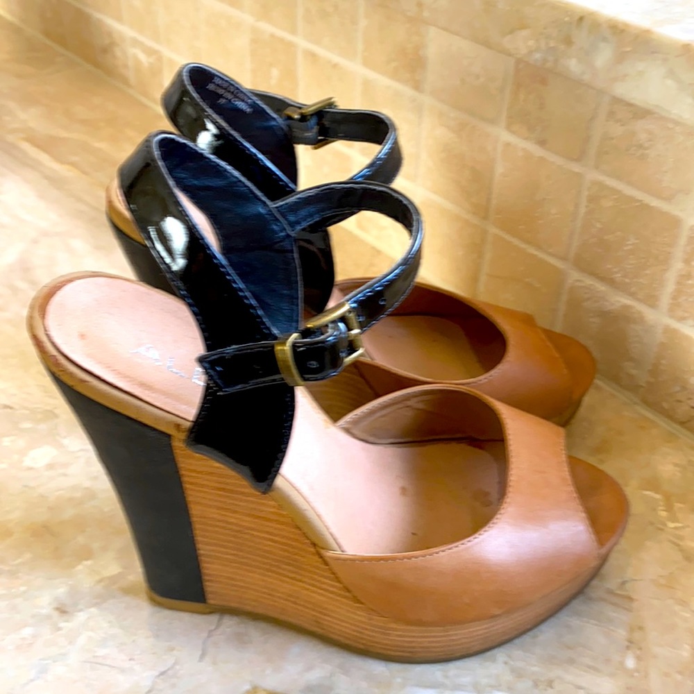 Super cute Aldo Black and Tan wedges.  Gently used.